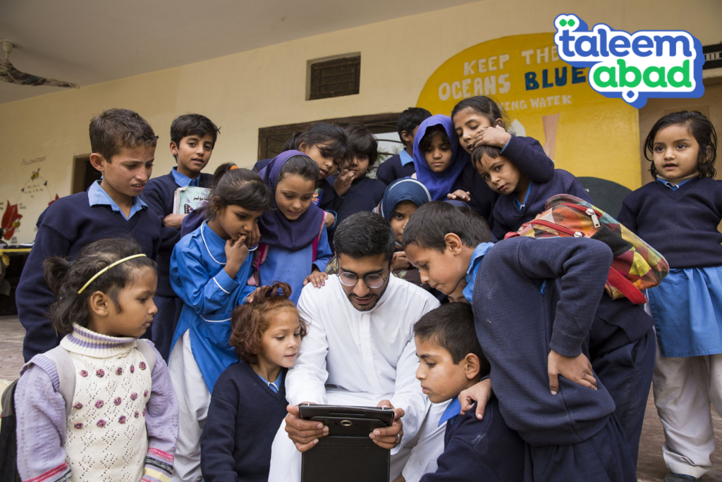 Picture of Taleemabad founder with students